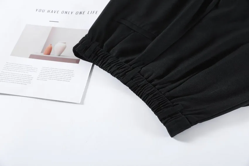 Women's Solid Wide-Leg Pleated Trousers for a Chic Look